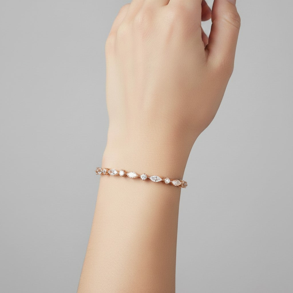 My Store 4 rose gold tennis bracelet featuring alternating marquise and round diamonds worn on a woman's wrist.