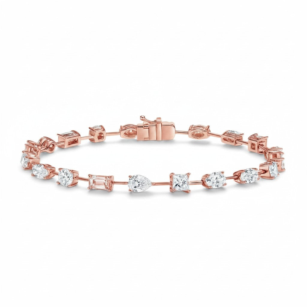 My Store 4 rose gold tennis bracelet featuring a mix of pear, emerald, princess, oval, and round cut diamonds.