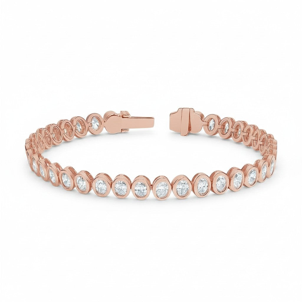 My Store 4 rose gold tennis bracelet featuring oval cut diamonds in a smooth protective bezel setting with a box clasp.