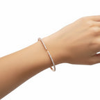 My Store 4 open-cuff bangle in rose gold with micro-pavé set diamonds worn on a wrist.