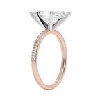 My Store 4 18K rose gold solitaire ring with a central lab-grown diamond and pavé-set diamond band, side view.