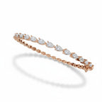 My Store 4 rose gold tennis bracelet featuring a continuous line of pear-cut diamonds in a secure prong setting.