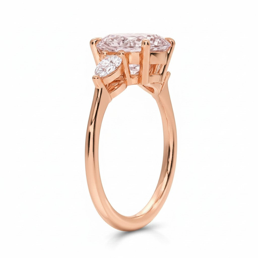 My Store 4 18K rose gold trilogy engagement ring featuring a pear-cut fancy color diamond and side stones