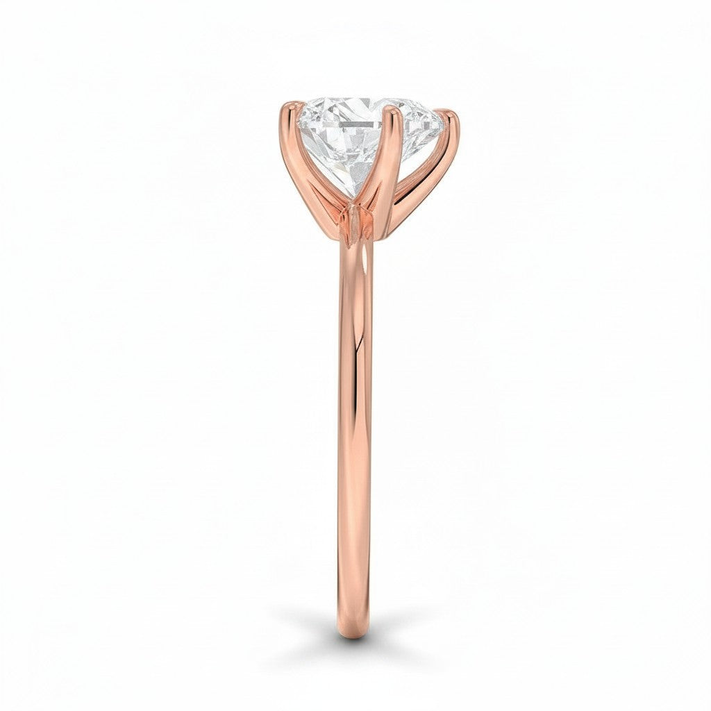 My Store 4 18K rose gold solitaire diamond ring viewed from the side, showcasing the prong setting and polished band.