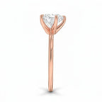 My Store 4 18K rose gold solitaire diamond ring viewed from the side, showcasing the prong setting and polished band.
