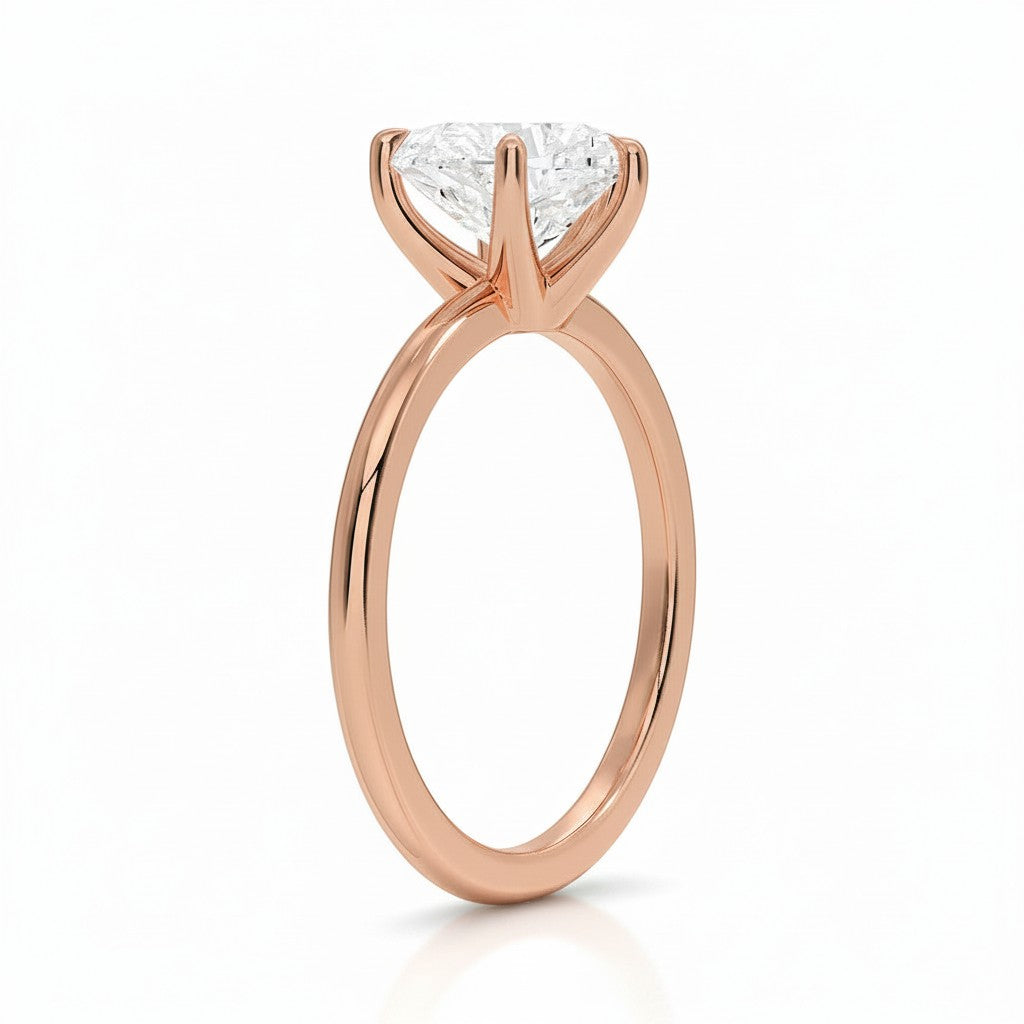 My Store 4 18K rose gold solitaire diamond ring featuring a brilliant cut stone in a classic four-prong setting