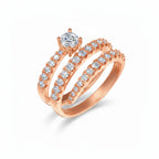 My Store 4 rose gold spiral coil engagement ring with a round brilliant solitaire diamond and pavé-set accent stones.