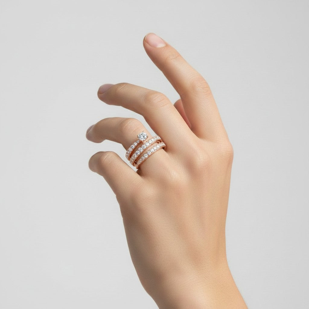 My Store 4 rose gold spiral coil engagement ring with a round solitaire diamond and pavé-set diamond multi-row band.