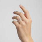 My Store 4 rose gold spiral coil engagement ring with a round solitaire diamond and pavé-set diamond multi-row band.