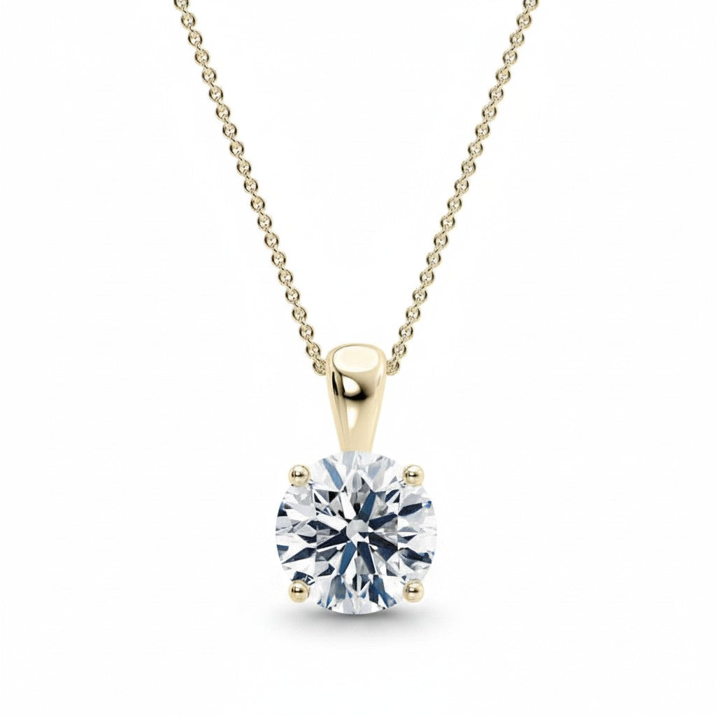 My Store 4 round brilliant-cut diamond solitaire pendant in 18K yellow gold with a four-prong setting on a delicate chain.