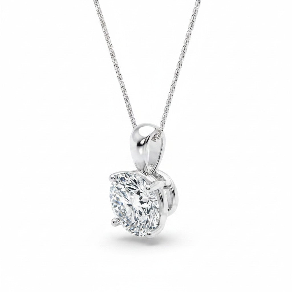 My Store 4 round brilliant-cut diamond solitaire pendant in a four-prong setting on a delicate white gold chain.