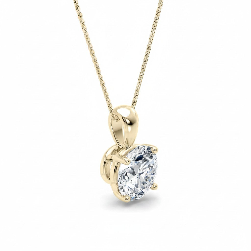 My Store 4 round brilliant-cut diamond solitaire pendant in 18K yellow gold with a four-prong setting and cable chain.