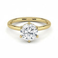 My Store 4 round cut solitaire engagement ring in yellow gold with a 6-prong setting and hidden micro-pavé halo.