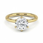My Store 4 round cut solitaire engagement ring in yellow gold with a 6-prong setting and hidden micro-pavé halo.