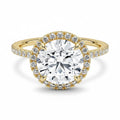 My Store 4 round brilliant cut diamond engagement ring with a micro-pavé halo and diamond-set 18K yellow gold band.