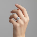 My Store 4 round cut solitaire engagement ring with compass prongs and hidden halo on a woman's hand