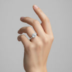 My Store 4 round cut solitaire engagement ring with a 6-prong setting and hidden halo on a woman's finger