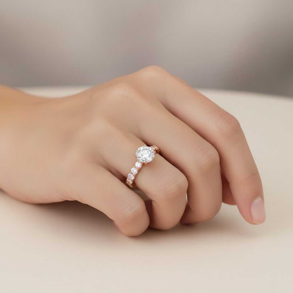 My Store 4 round cut solitaire engagement ring with a full eternity diamond band in 18K rose gold on a hand.