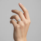 My Store 4 round cut solitaire engagement ring with a 6-prong setting on a yellow gold band worn on a hand