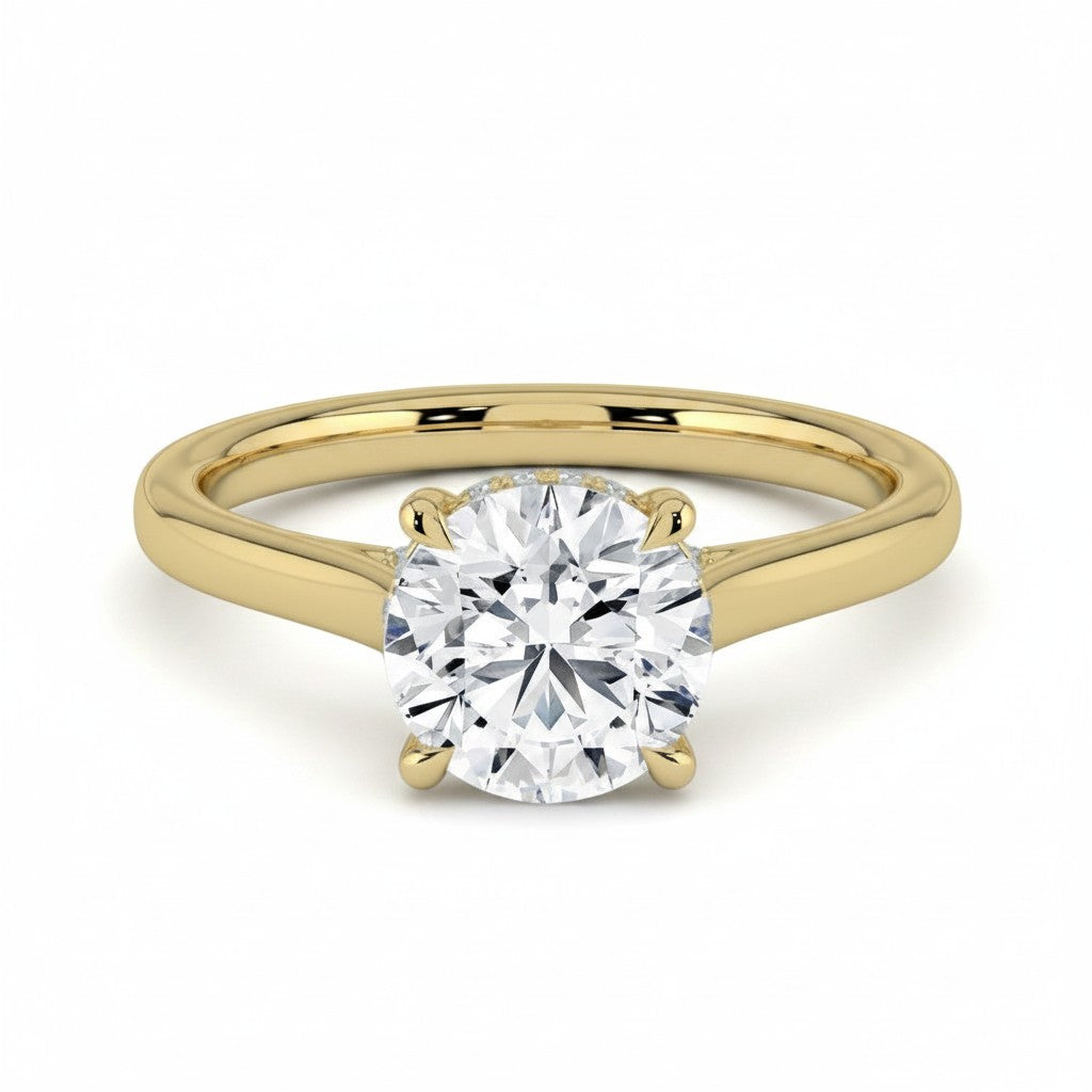 My Store 4 round cut solitaire engagement ring in yellow gold with a hidden halo and cathedral setting
