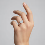 My Store 4 round cut solitaire engagement ring with a triple-row micro-pavé band on a woman's hand.