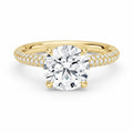 My Store 4 round cut solitaire engagement ring in yellow gold with a triple-row micro-pavé diamond band.
