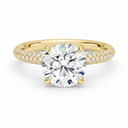 My Store 4 round cut solitaire engagement ring in yellow gold with a triple-row micro-pavé diamond band.