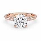 My Store 4 round cut solitaire engagement ring in rose gold with a triple-row micro-pavé diamond band.