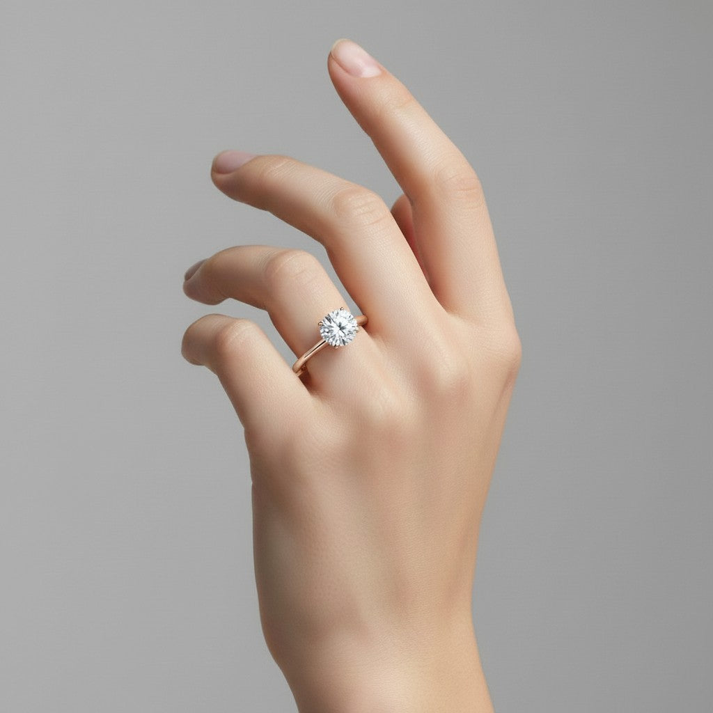 My Store 4 classic round cut solitaire engagement ring with a brilliant diamond on a slim polished rose gold band