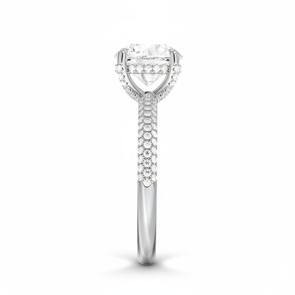My Store 4 round cut solitaire engagement ring in white gold with a triple-row micro-pavé diamond band, side view.