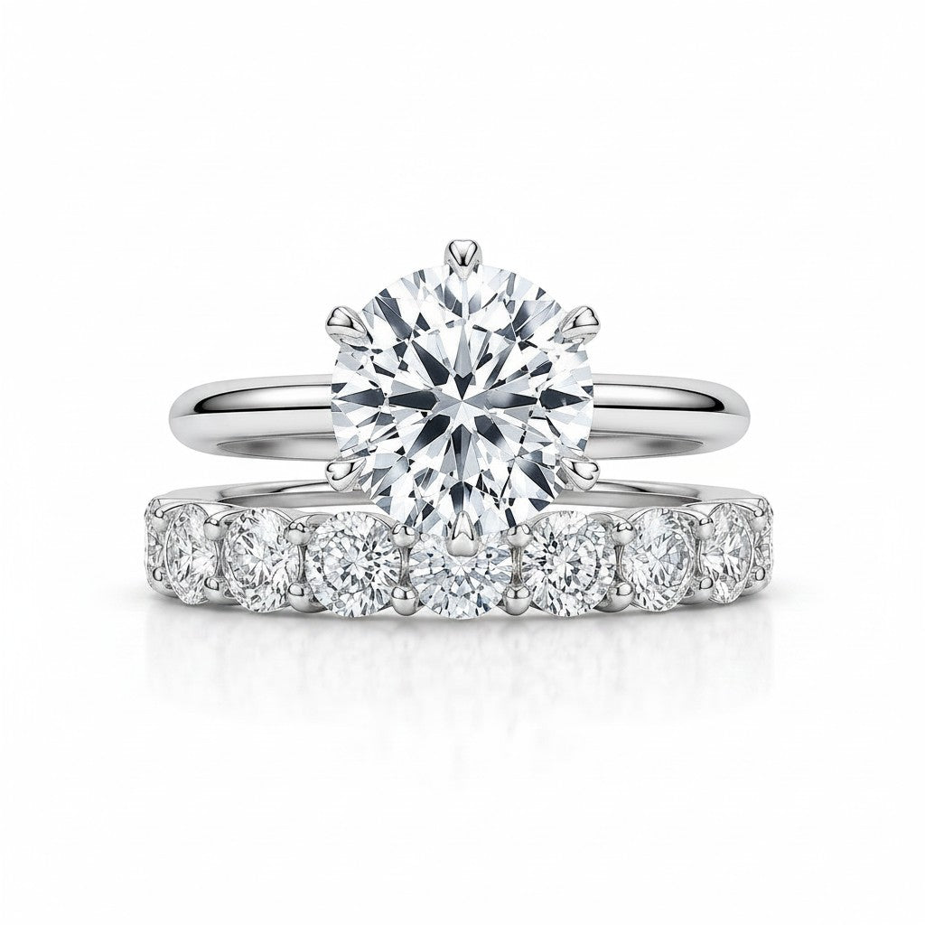 My Store 4 round tulip solitaire engagement ring and shared-prong eternity band set in polished white gold.