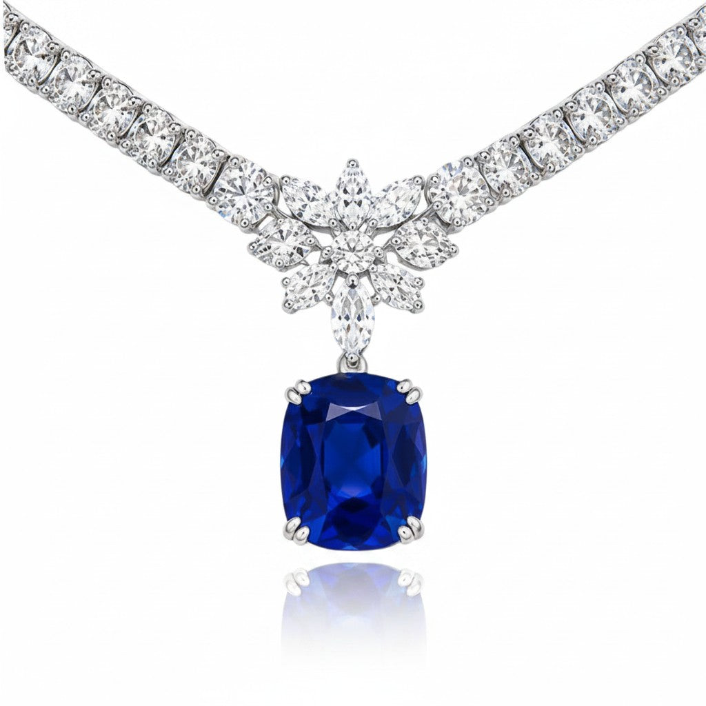 My Store 4 18K white gold necklace featuring a large cushion-cut blue sapphire pendant surrounded by marquise diamonds.