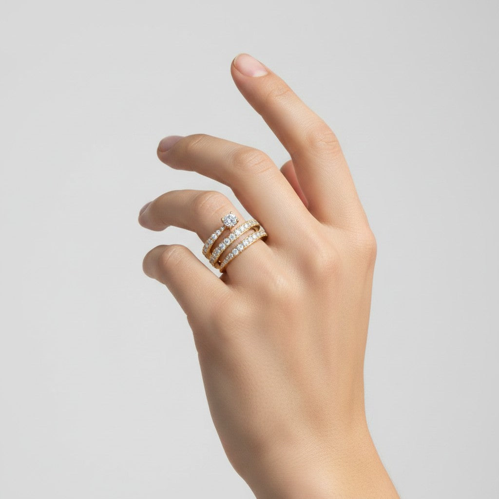My Store 4 spiral coil multi-band engagement ring in yellow gold with a round solitaire diamond and pavé accents.
