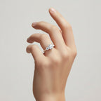 My Store 4 three-stone engagement ring with round diamonds and micro-pavé band on a woman's hand in yellow gold