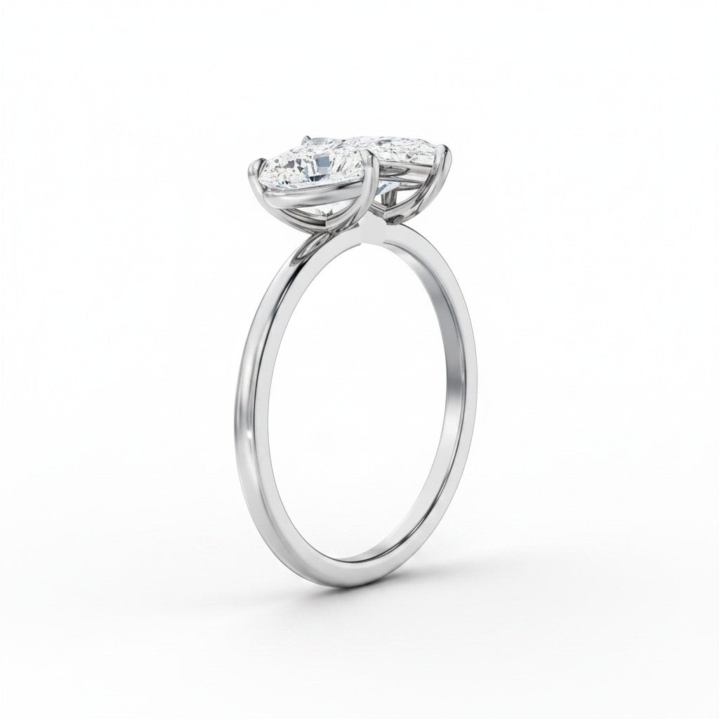 My Store 4 18K solid gold Toi et Moi ring featuring a pear and heart cut lab-grown diamond side profile view