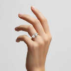 My Store 4 18K solid gold Toi et Moi ring featuring a pear and heart-cut lab-grown diamond on a woman's finger.