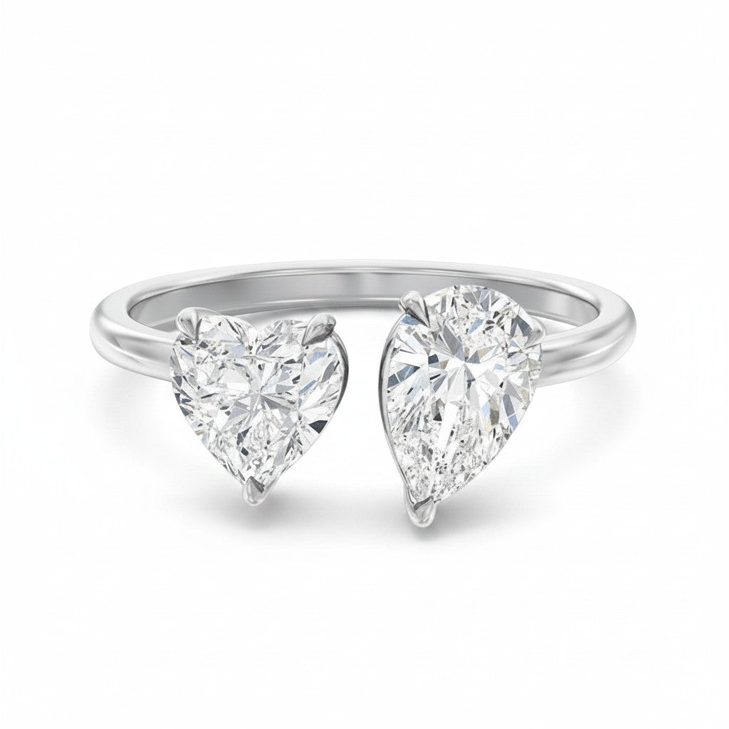 My Store 4 18K solid gold Toi et Moi ring featuring a pear-cut and heart-cut lab-grown diamond in a bypass setting.