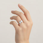 My Store 4 Toi et Moi engagement ring with round and oval diamonds on a pavé gold band worn on a woman's hand