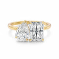 My Store 4 Toi et Moi ring featuring a pear-cut and radiant-cut diamond on a polished yellow gold band.