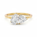 My Store 4 Toi et Moi engagement ring featuring a pear and trillion cut diamond set in 18K yellow gold.