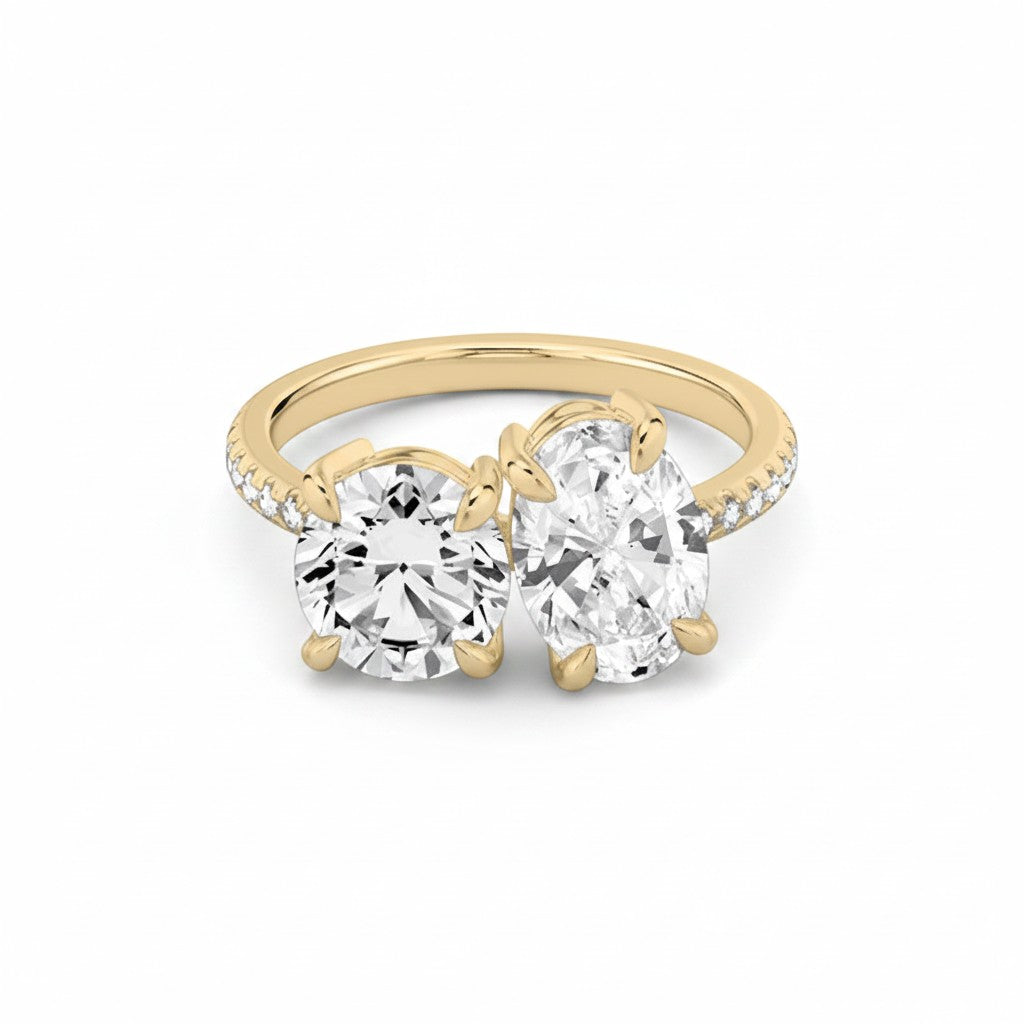 My Store 4 Toi et Moi engagement ring with round and oval diamonds on a pavé solid yellow gold band.