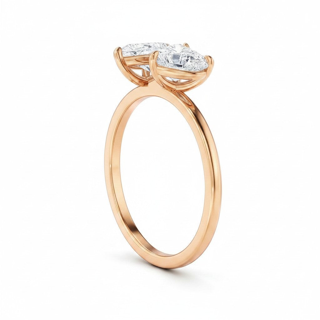 My Store 4 18K solid gold Toi et Moi ring featuring a pear and heart-cut lab-grown diamond side profile view