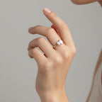 My Store 4 Toi et Moi engagement ring featuring two pear-cut diamonds on a polished yellow gold band worn on a finger