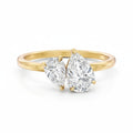 My Store 4 Toi et Moi engagement ring with two pear-cut diamonds on a polished 18K yellow gold band.