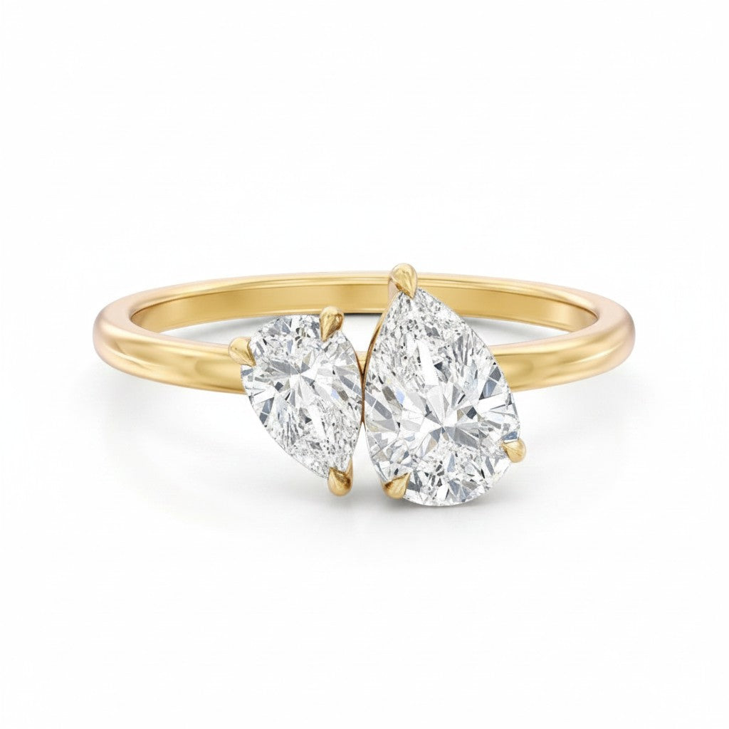 My Store 4 Toi et Moi engagement ring with two pear-cut diamonds on a polished 18K yellow gold band.