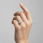 My Store 4 Toi et Moi engagement ring featuring two pear-cut diamonds on a pavé solid gold band worn on a hand