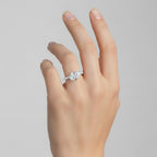My Store 4 Toi et Moi engagement ring with dual pear-cut diamonds and a micro-pavé band on a woman's finger.