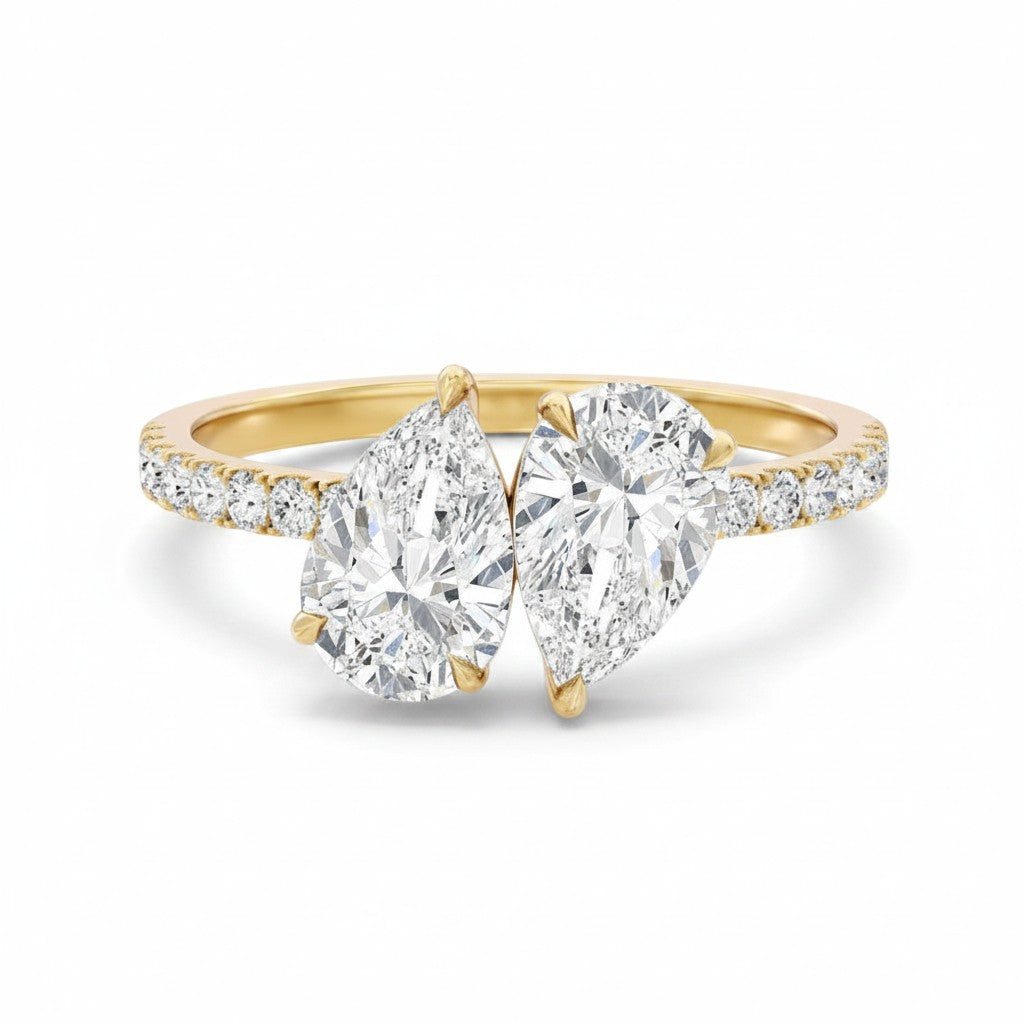 My Store 4 Toi et Moi engagement ring with two pear-cut diamonds on a yellow gold micro-pavé band.