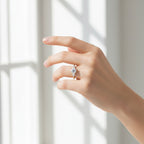 My Store 4 18K solid gold trilogy ring with three lab-grown diamonds worn on a woman's finger in soft natural light.