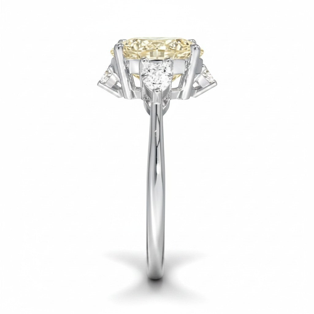 My Store 4 18K solid gold trilogy engagement ring with a pear-cut lab-grown diamond and side stones, side view.
